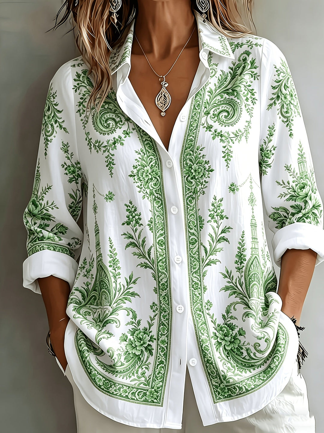 Women's oversized long sleeve blouse with vibrant floral paisley print. Perfect for chic casual wear.