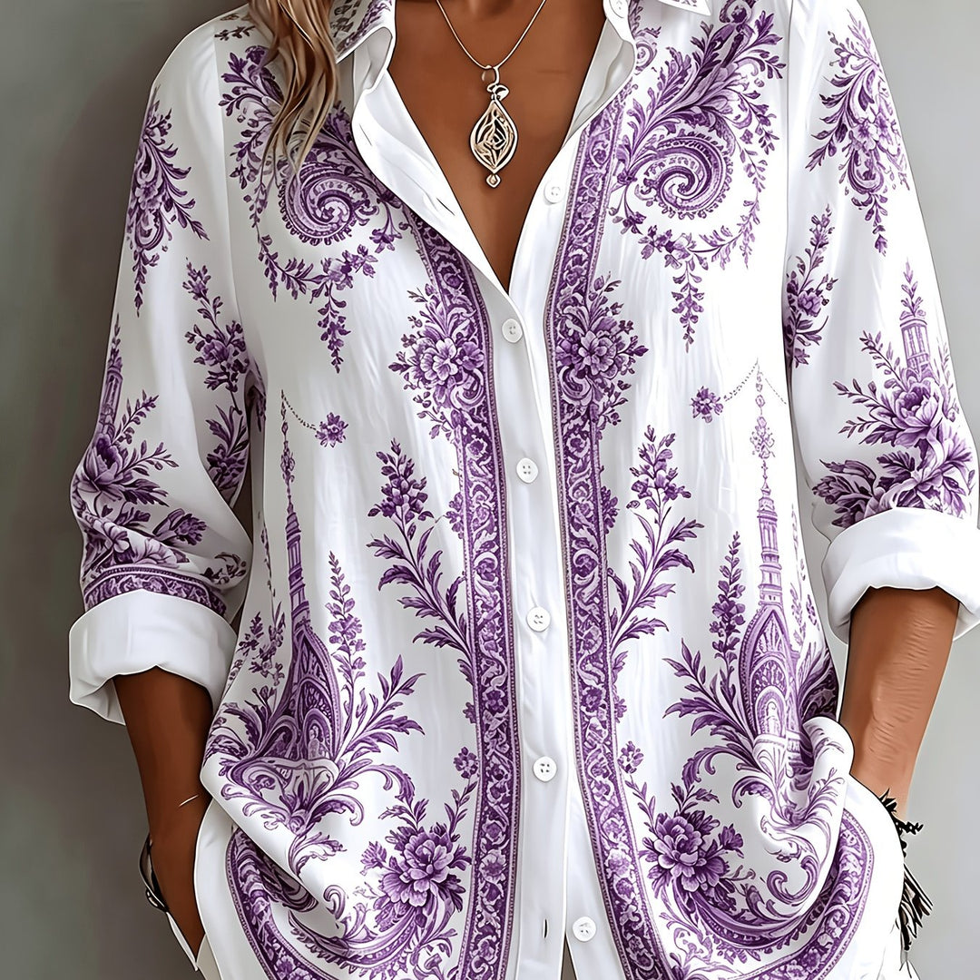Detailed floral paisley print on a women's oversized long sleeve button-down blouse. Stylish summer top.