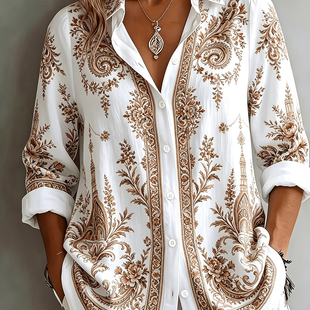 Full shot of a women's floral paisley oversized long sleeve blouse. Casual yet stylish summer fashion.