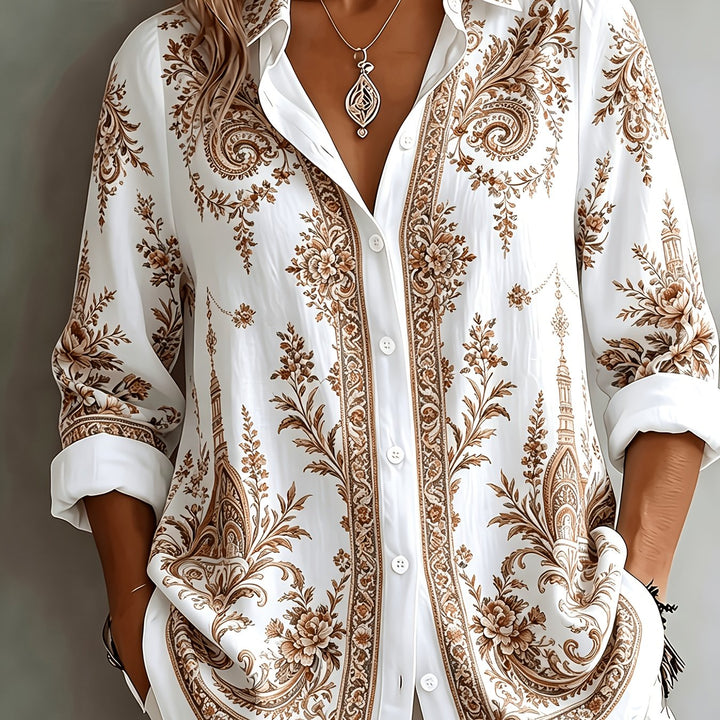 Full shot of a women's floral paisley oversized long sleeve blouse. Casual yet stylish summer fashion.