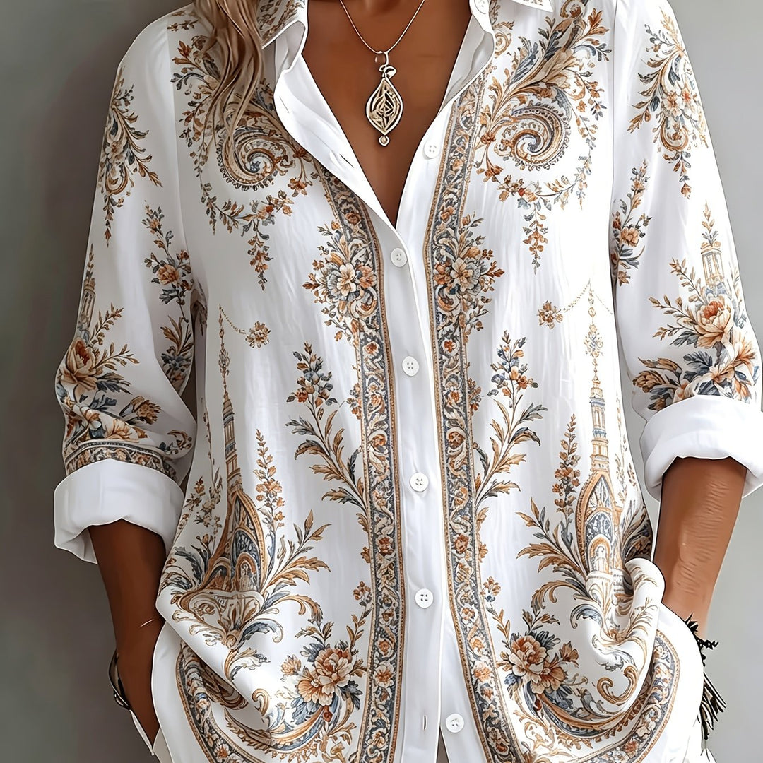 Mannequin displaying a women's oversized long sleeve floral paisley blouse, a chic and trendy summer top.