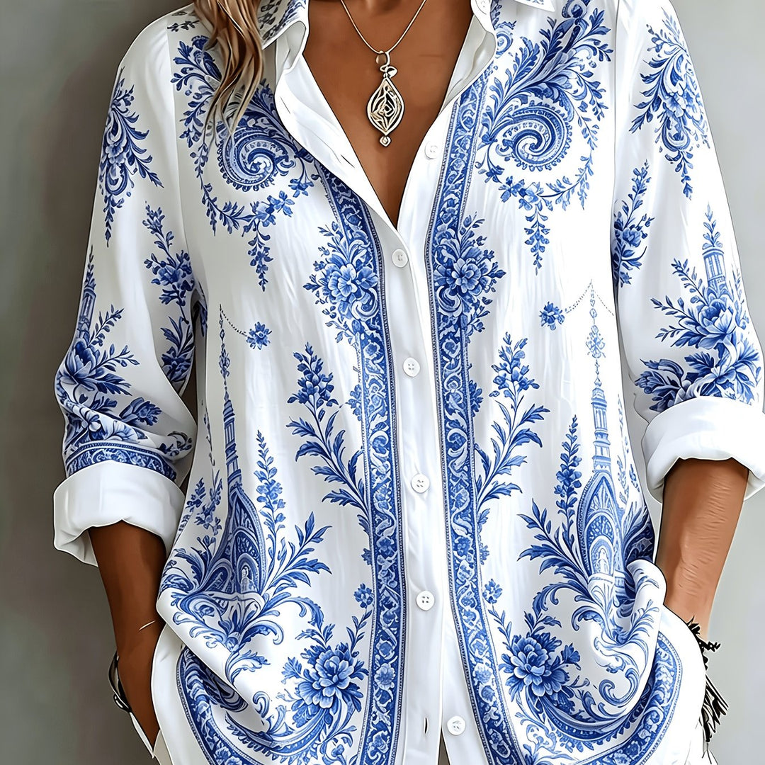 Women's oversized floral paisley long sleeve blouse paired with jeans. A chic casual summer outfit.