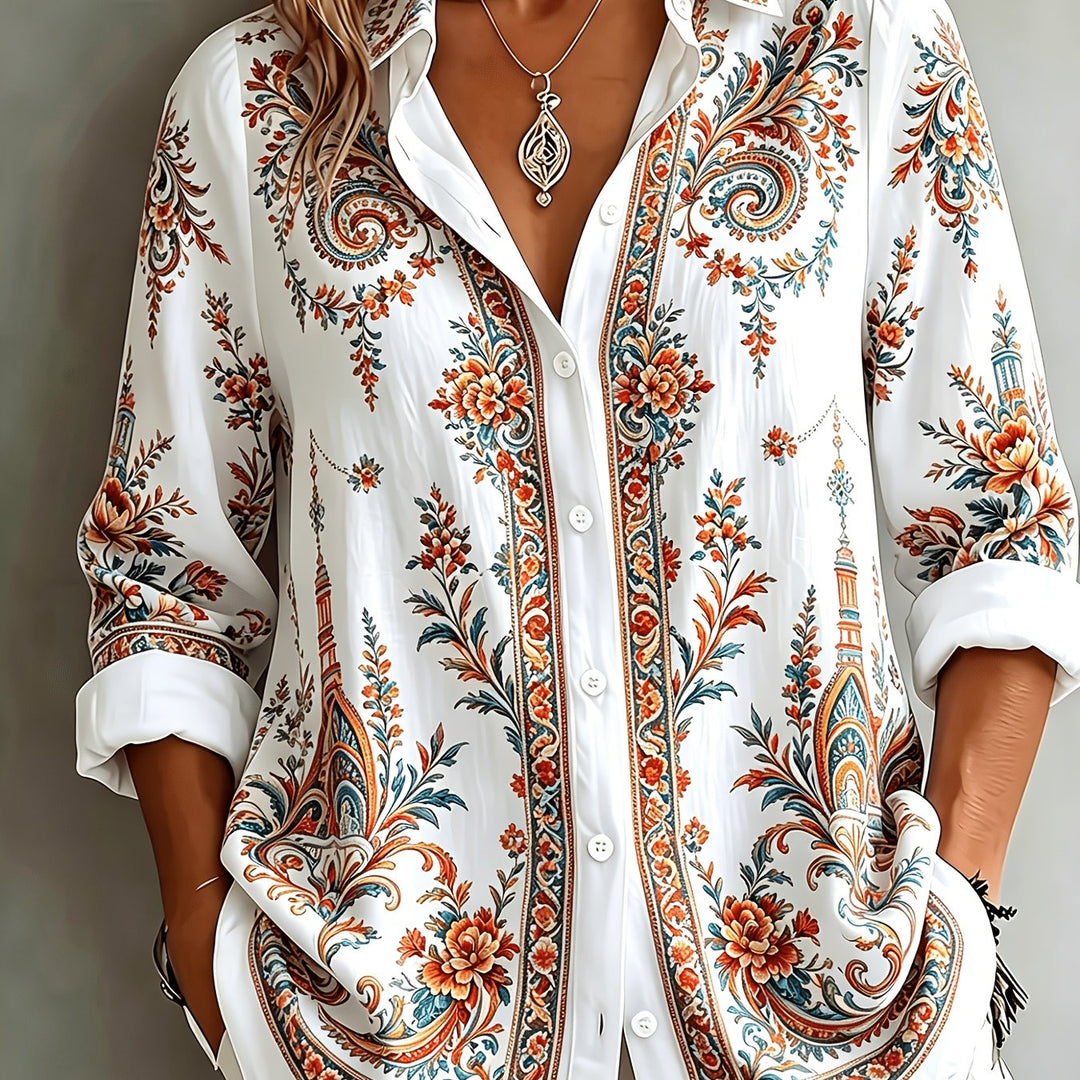 Woman enjoying a relaxed day in a floral paisley oversized long sleeve blouse. Perfect casual summer wear.