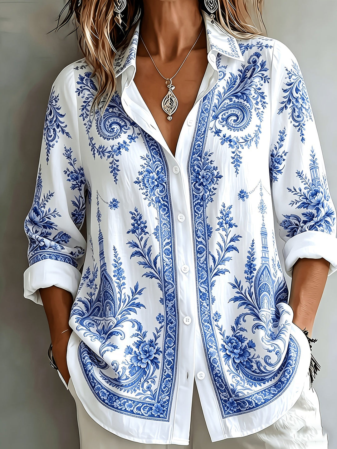 Elegant women's oversized long sleeve blouse showcasing a beautiful floral paisley print. Casual & stylish.