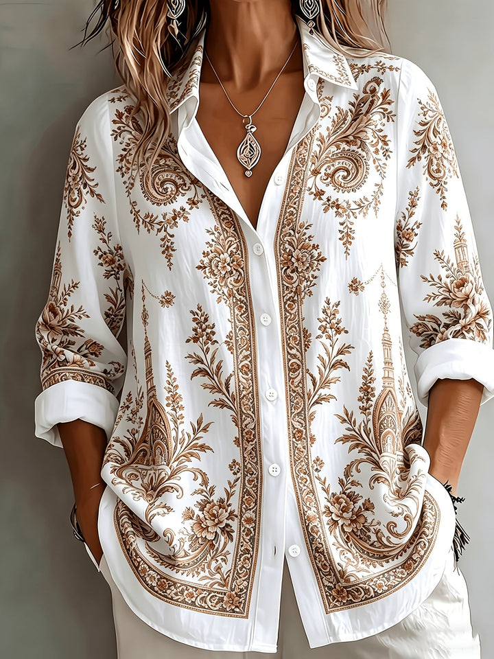 Button-down women's long sleeve blouse, oversized with an eye-catching floral paisley print. Casual top.