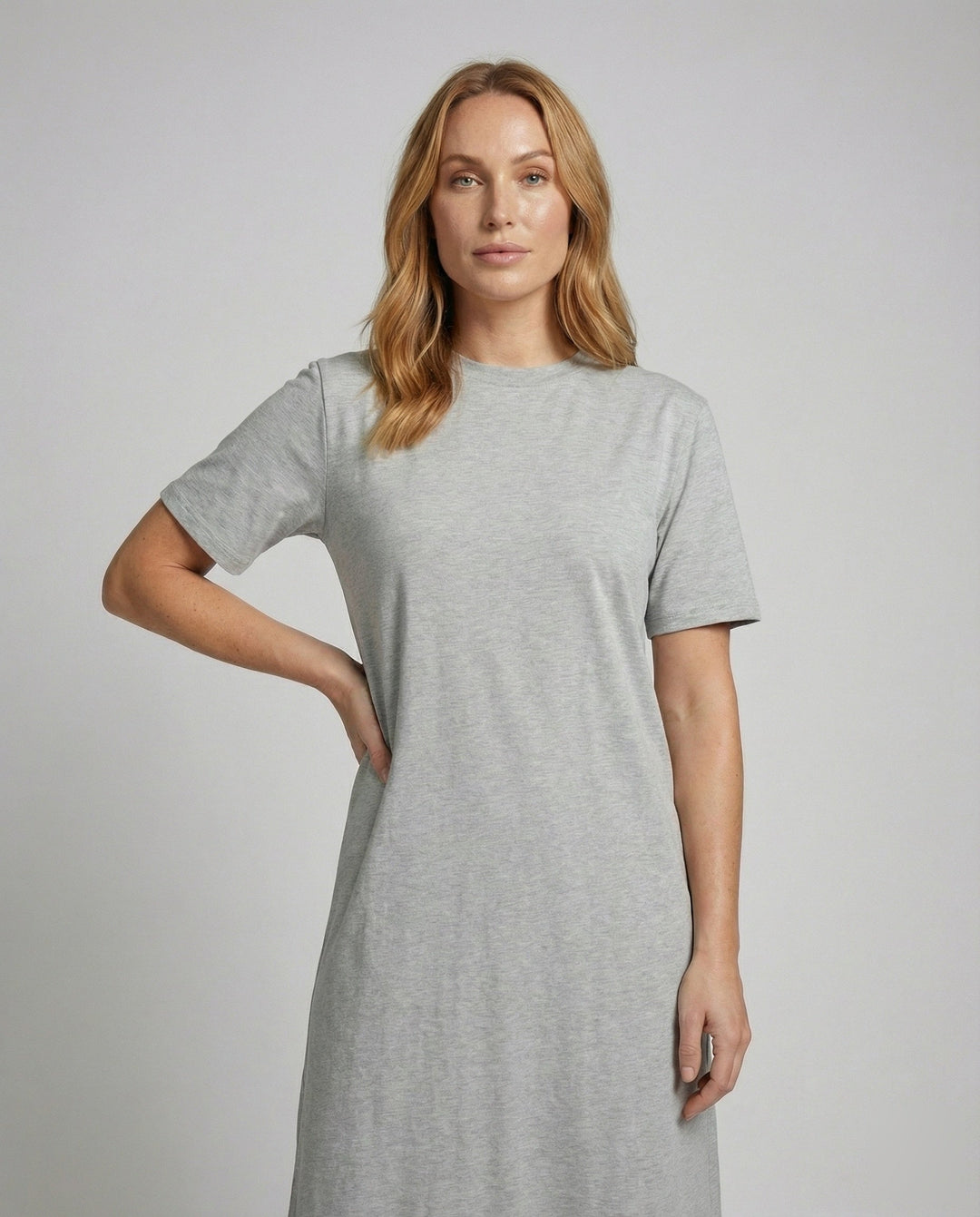 Stylish women's short sleeve mock neck maxi dress with a trendy side split, offering versatile minimalist fashion.