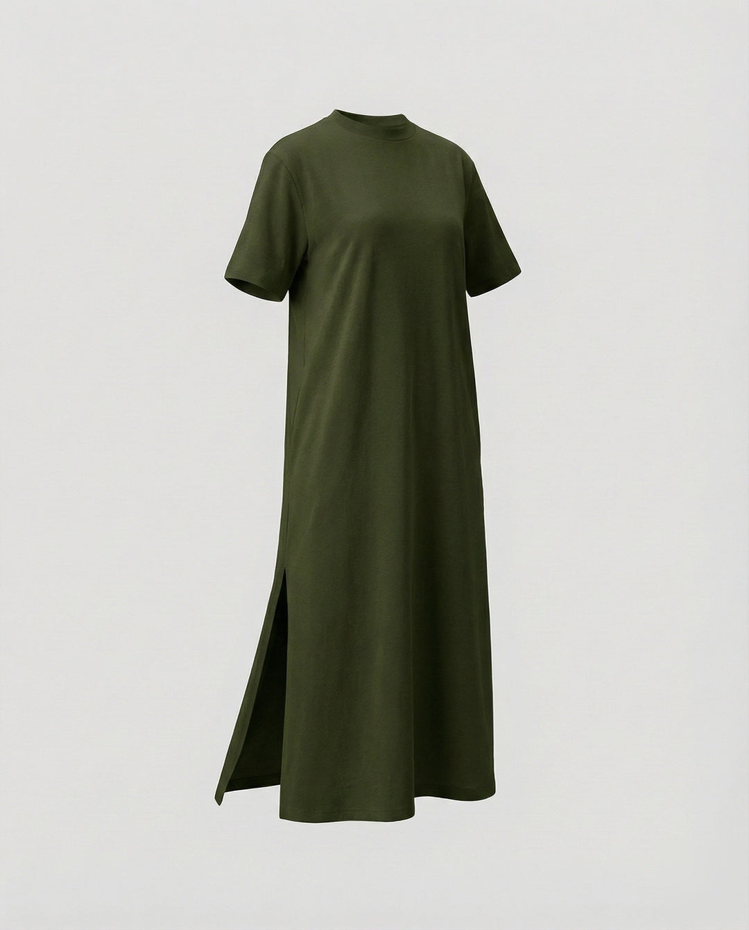 Trendy women's oversized short sleeve mock neck maxi dress with a high side split, embracing modern minimalist style.