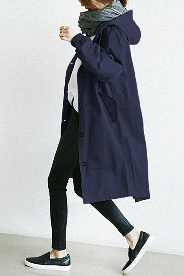 Lightweight oversized women's rain parka, a water resistant trench coat. Versatile women's outerwear.
