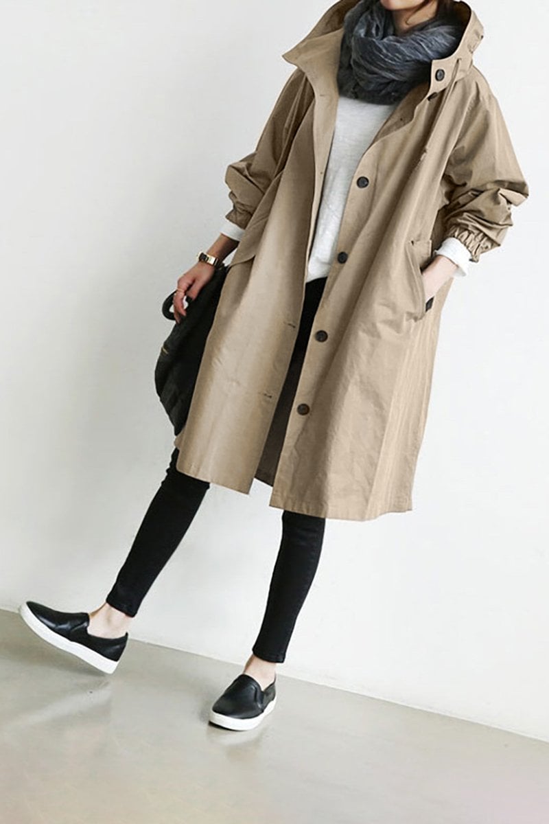 Stylish women's oversized water resistant trench coat, a chic rain parka perfect for spring fashion.