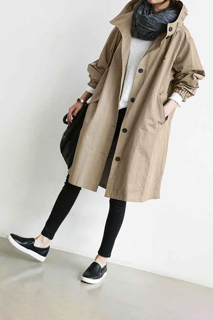 Stylish women's oversized water resistant trench coat, a chic rain parka perfect for spring fashion.