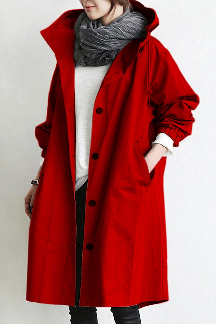 Versatile women's oversized rain parka, a water resistant trench coat for layering in spring/fall.