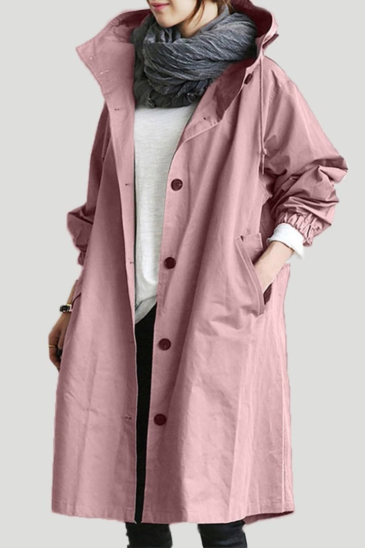 Practical women's oversized rain parka trench coat, water resistant & fashionable for daily wear.