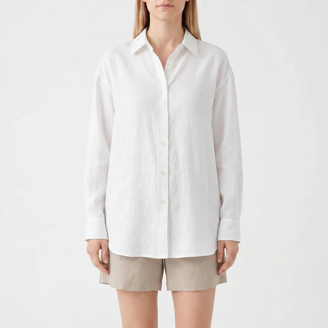 Stylish women's oversized summer blouse. Versatile, lightweight top ideal for casual, relaxed fashion outfits.