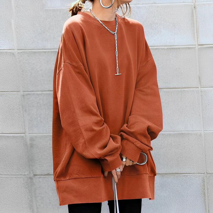 Soft women's oversized sweatshirt, a comfortable loungewear piece with a relaxed fit and dropped shoulder.