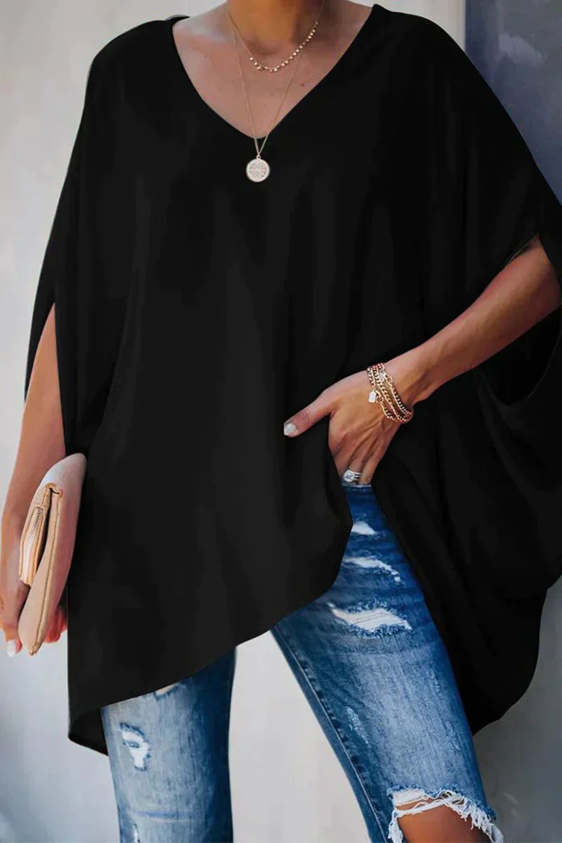 Effortless women's oversized v-neck tunic top featuring trendy batwing sleeves. Ideal for comfortable casual style.