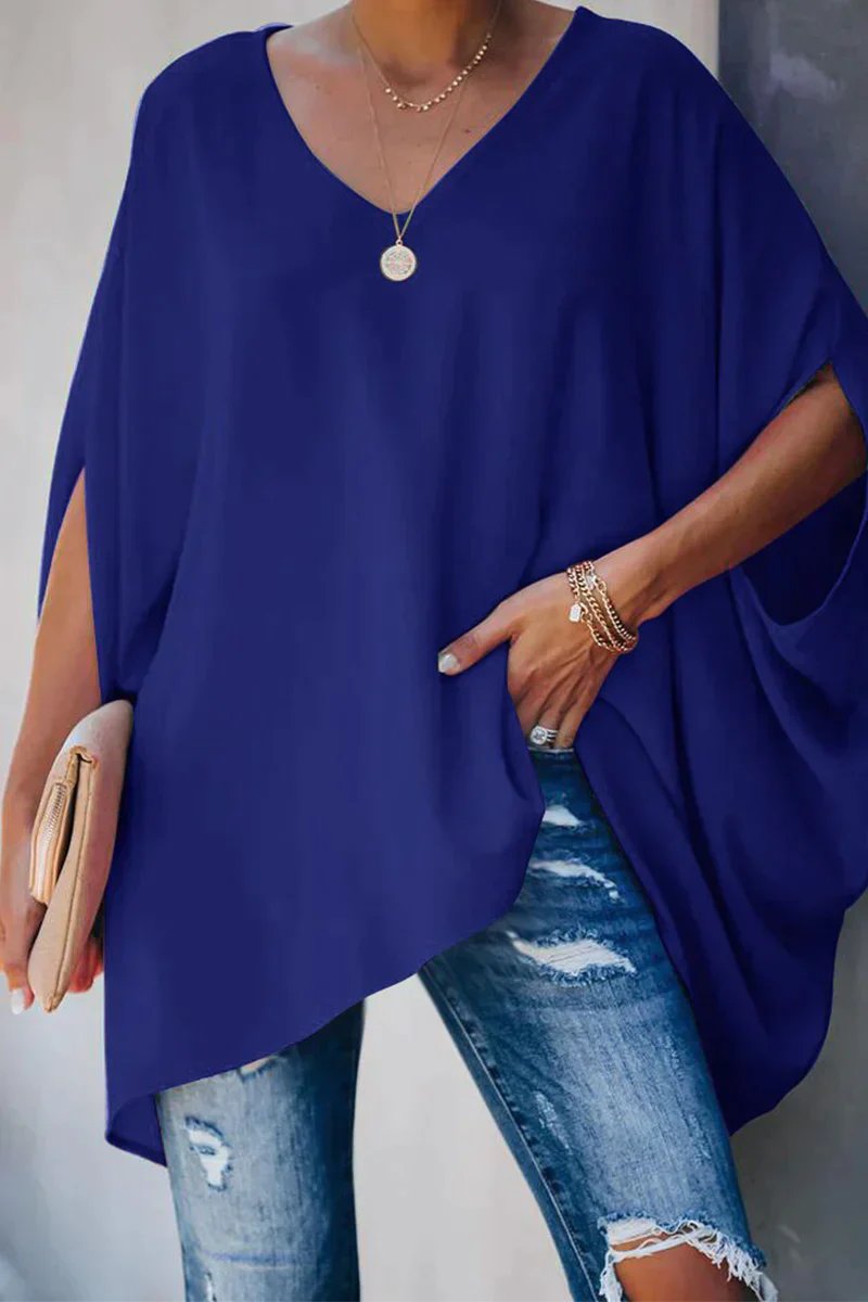 Stylish women's oversized tunic top with wide batwing sleeves & a flattering v-neck, offering a relaxed casual fit.