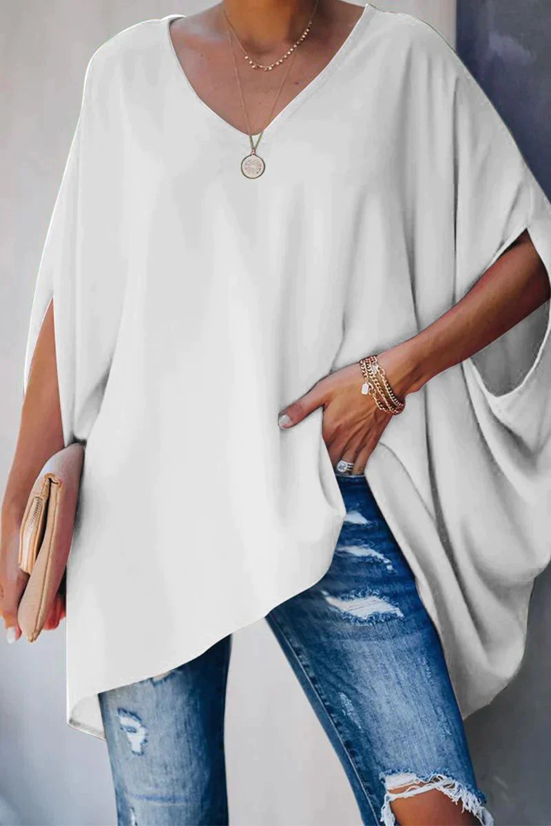 Comfortable women's oversized v-neck tunic top with trendy batwing sleeves. Ideal for relaxed everyday casual wear.