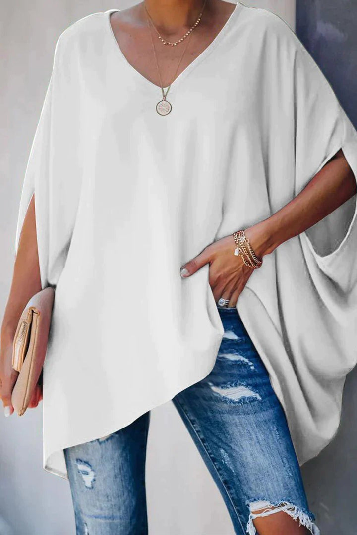 Comfortable women's oversized v-neck tunic top with trendy batwing sleeves. Ideal for relaxed everyday casual wear.