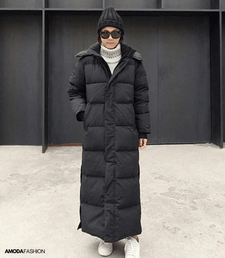 Women's oversized waterproof winter parka in a trendy long design, perfect for warm, casual cold weather outerwear.