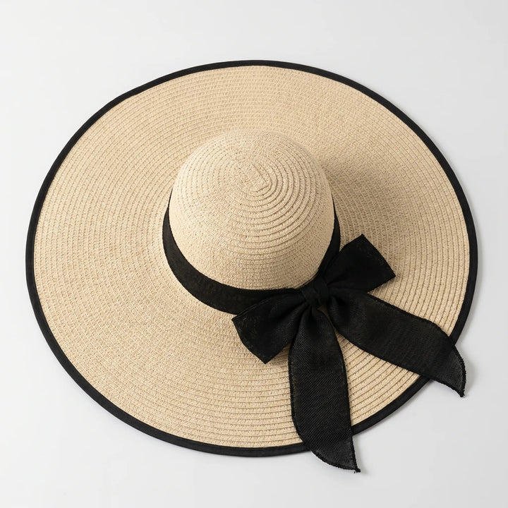 Oversized wide brim beach hat for women, perfect for summer vacations and sun protection.