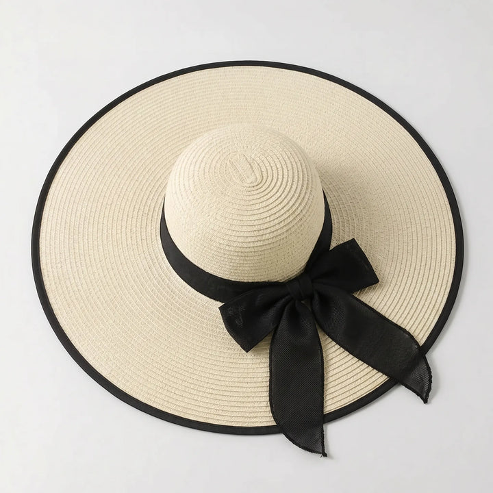 Large oversized wide brim sun hat for women, ideal for beach, travel, and superior sun protection.