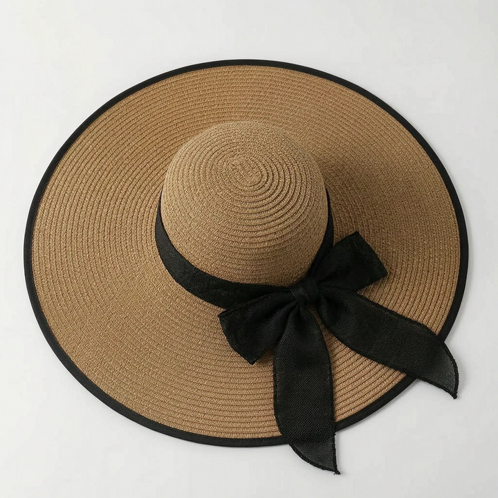 Women's fashionable oversized wide brim sun hat, essential for summer, beach, and vacation protection.