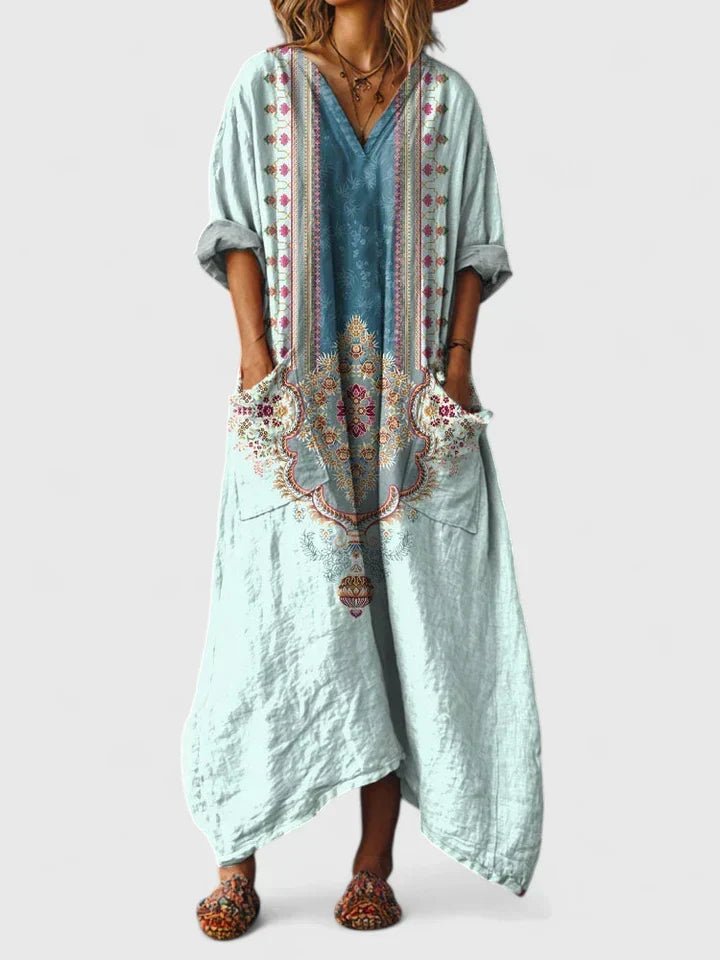 Stylish women's V-neck paisley boho maxi dress, featuring a unique print, flowing fabric, and practical patch pockets.