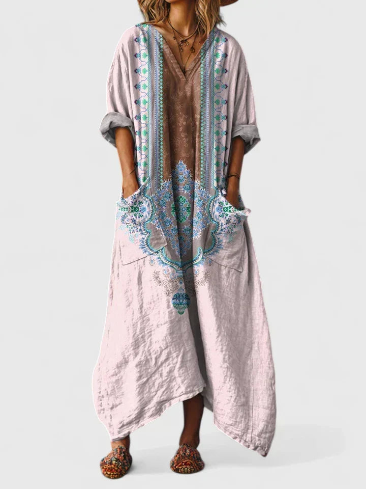 Unique women's flowing paisley print maxi dress, bohemian style, V-neck, and essential patch pockets.