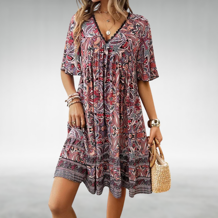 Vibrant paisley boho mini dress for women with delicate lace trim, ideal for summer casual or festival days.