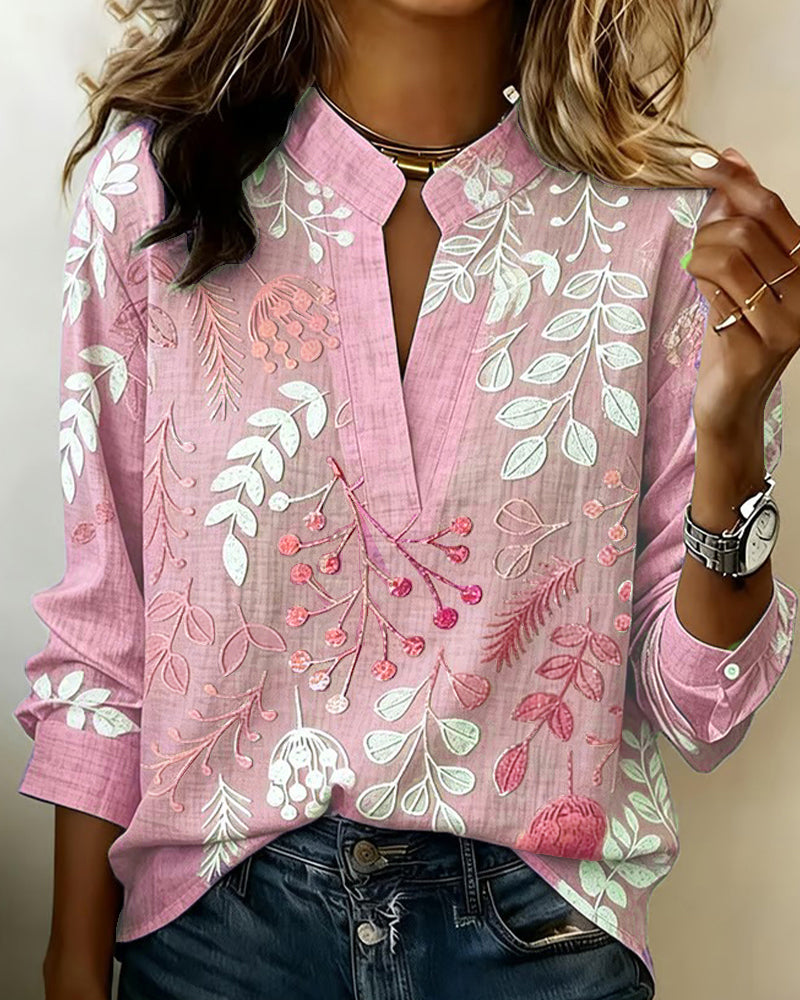 Casual elegant women's pastel floral V-neck blouse, offering comfortable yet chic style.