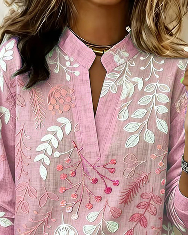 Beautiful women's pastel floral print V-neck blouse, featuring a light and airy design.