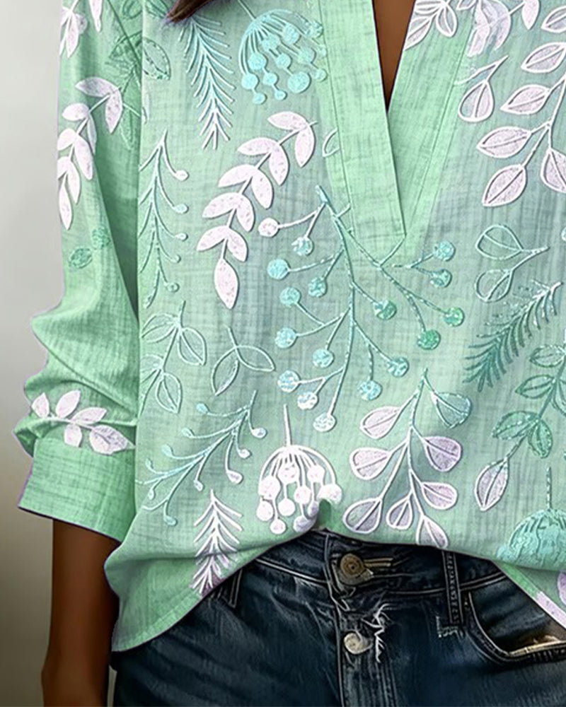 Women's pastel floral V-neck blouse, a versatile elegant top for spring, summer, & workwear.