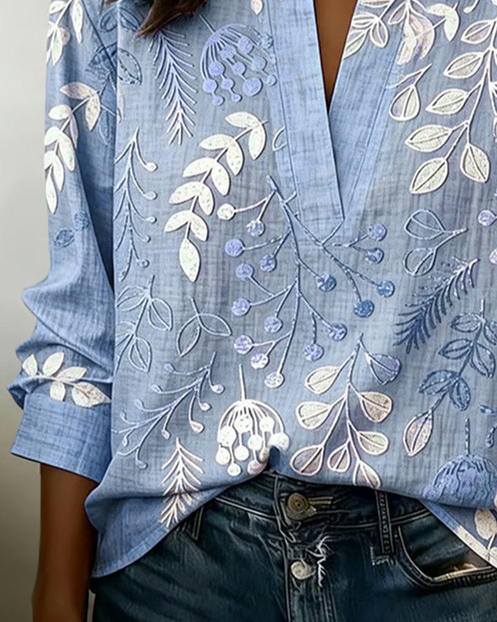 Comfortable long sleeve women's pastel floral V-neck blouse, great for spring layering.