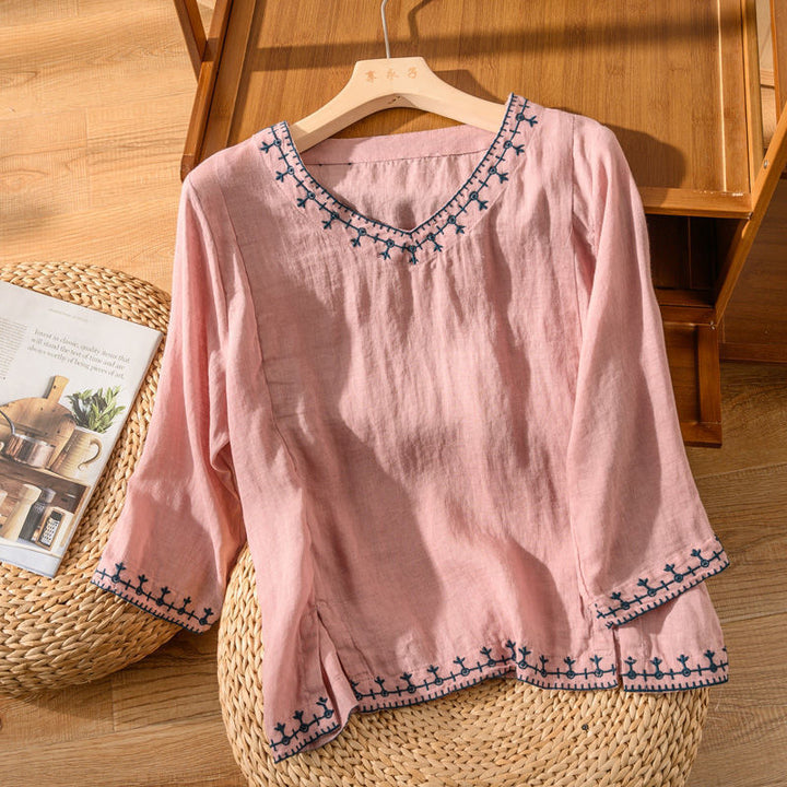 Comfortable women's patterned short sleeve V-neck top. Versatile blouse for chic spring & summer outfits.