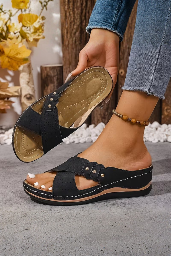 Casual women's perforated wedge sandals. Stylish slip-on summer footwear, perfect for travel.