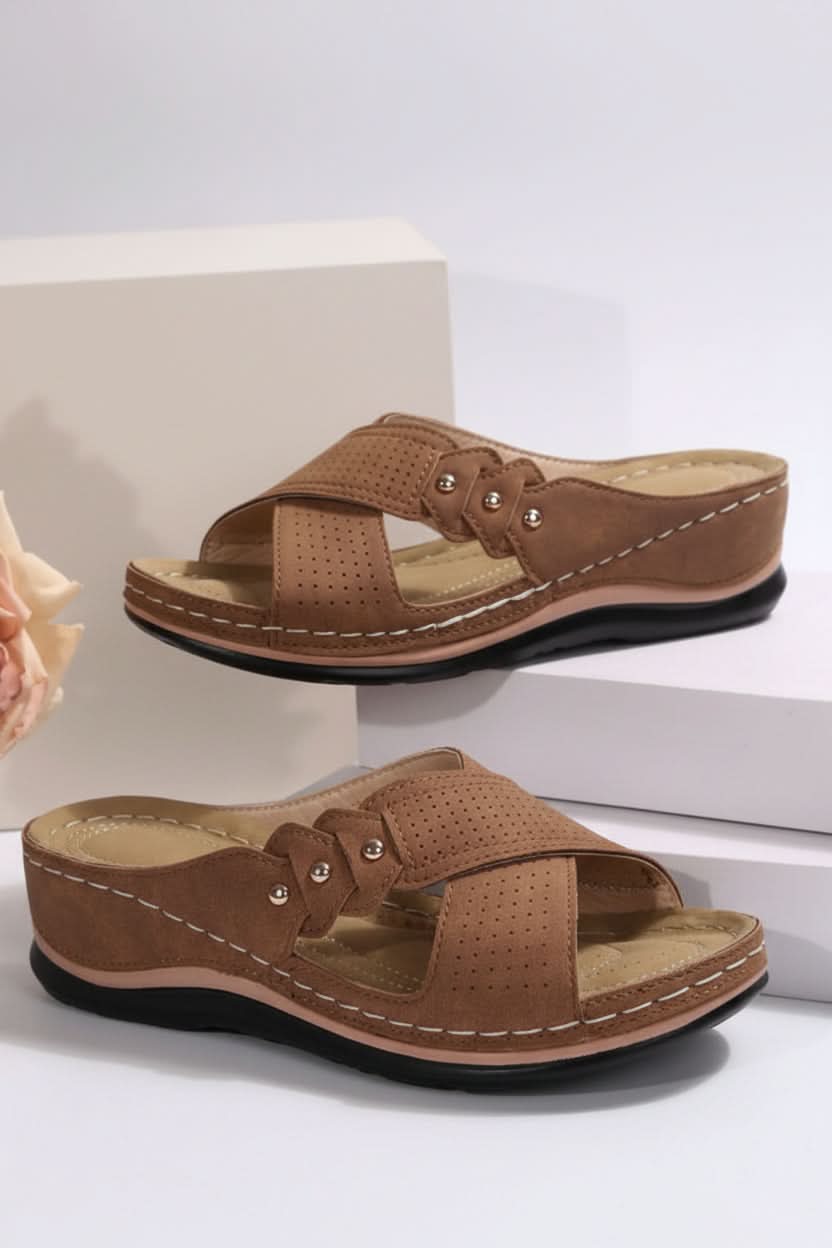 Women's comfort wedge slip-on sandals. Perforated design for breathable summer everyday and travel wear.