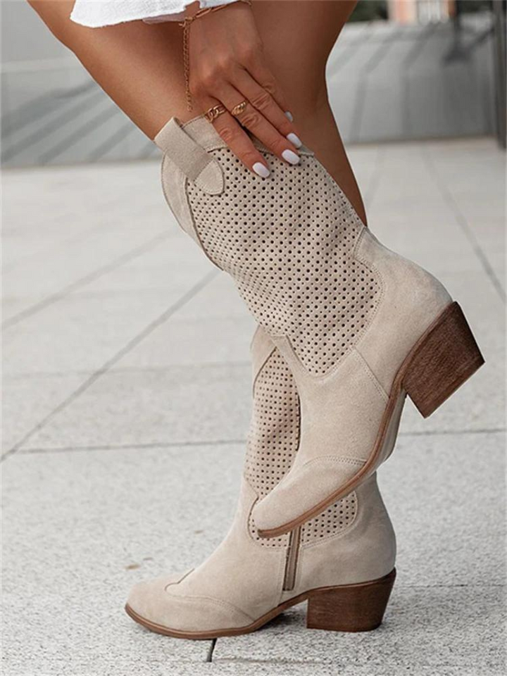 Versatile ladies' western mid-calf boots featuring perforated detailing, pull tabs & a comfortable low heel.