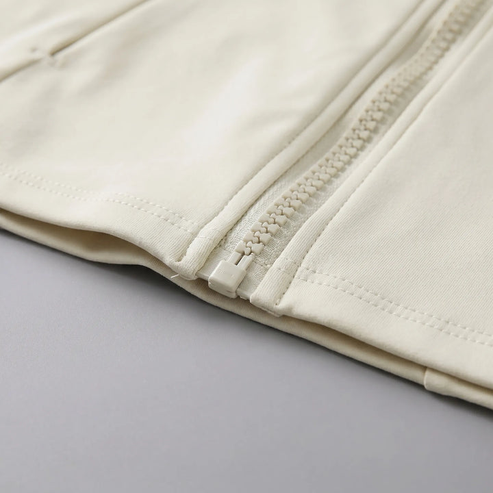 Stylish women's athletic jacket, full-zip, with thumbholes; great for gym wear & active performance.