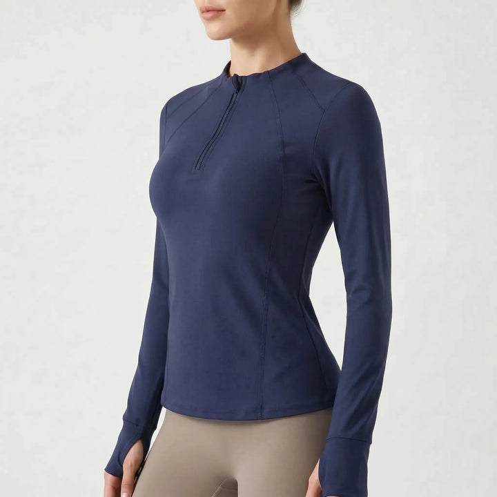 Women's quarter-zip sports top. Long-sleeve athletic shirt for a comfortable & stylish workout.