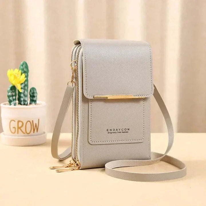 Hands-free women's phone shoulder bag, with a clear touchscreen pocket for quick use.
