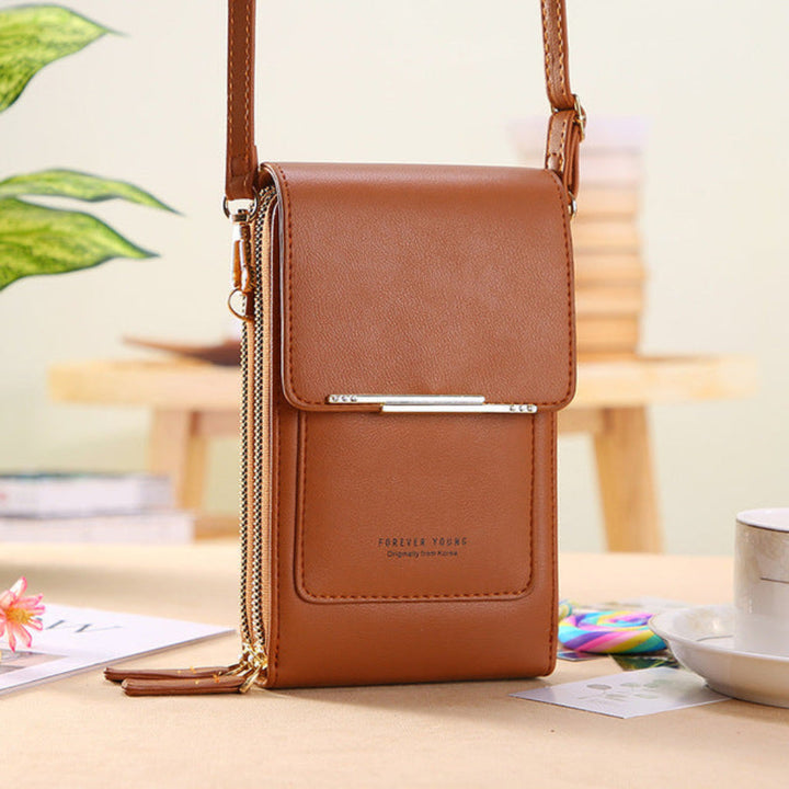 Women's phone shoulder bag with clear touchscreen window for easy access to smartphone. Ideal daily essential.