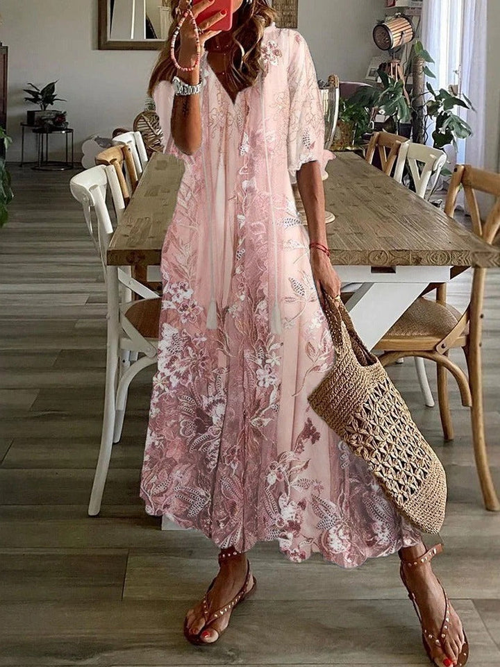 Women's pink floral V-neck half sleeve loose maxi dress for elegant spring & summer casual wear.