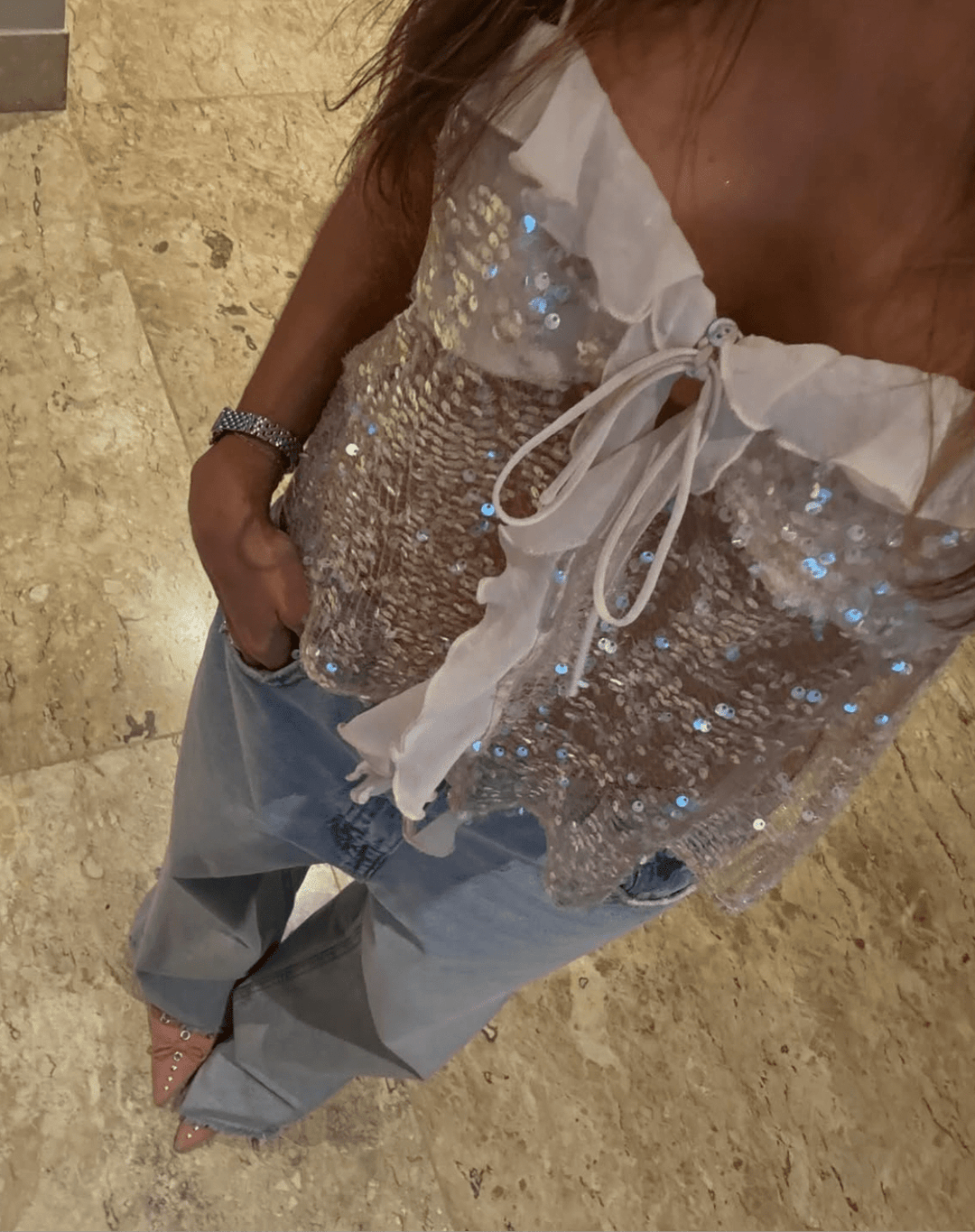 Glamorous women's sequin top with a delicate ruffle and stylish tie-front. Ideal for party wear & festival fashion.