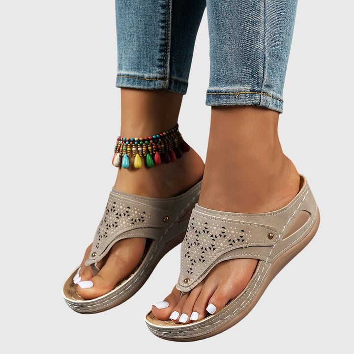 Fashionable women's platform sandals with secure ankle strap, perfect for elegant summer outfits.