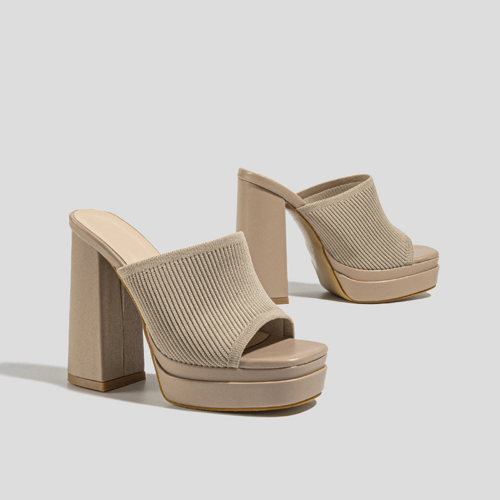 Women's open-toe platform sandals, designed for summer comfort with adjustable straps & secure fit.