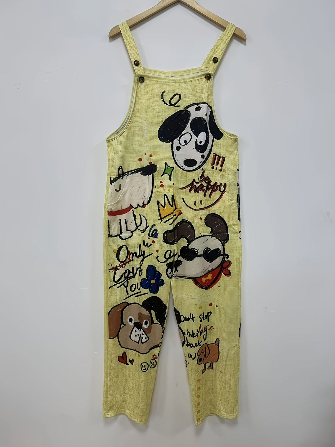 Woman walking in playful dog print wide-leg jumpsuit, adjustable straps, showing fluid movement.