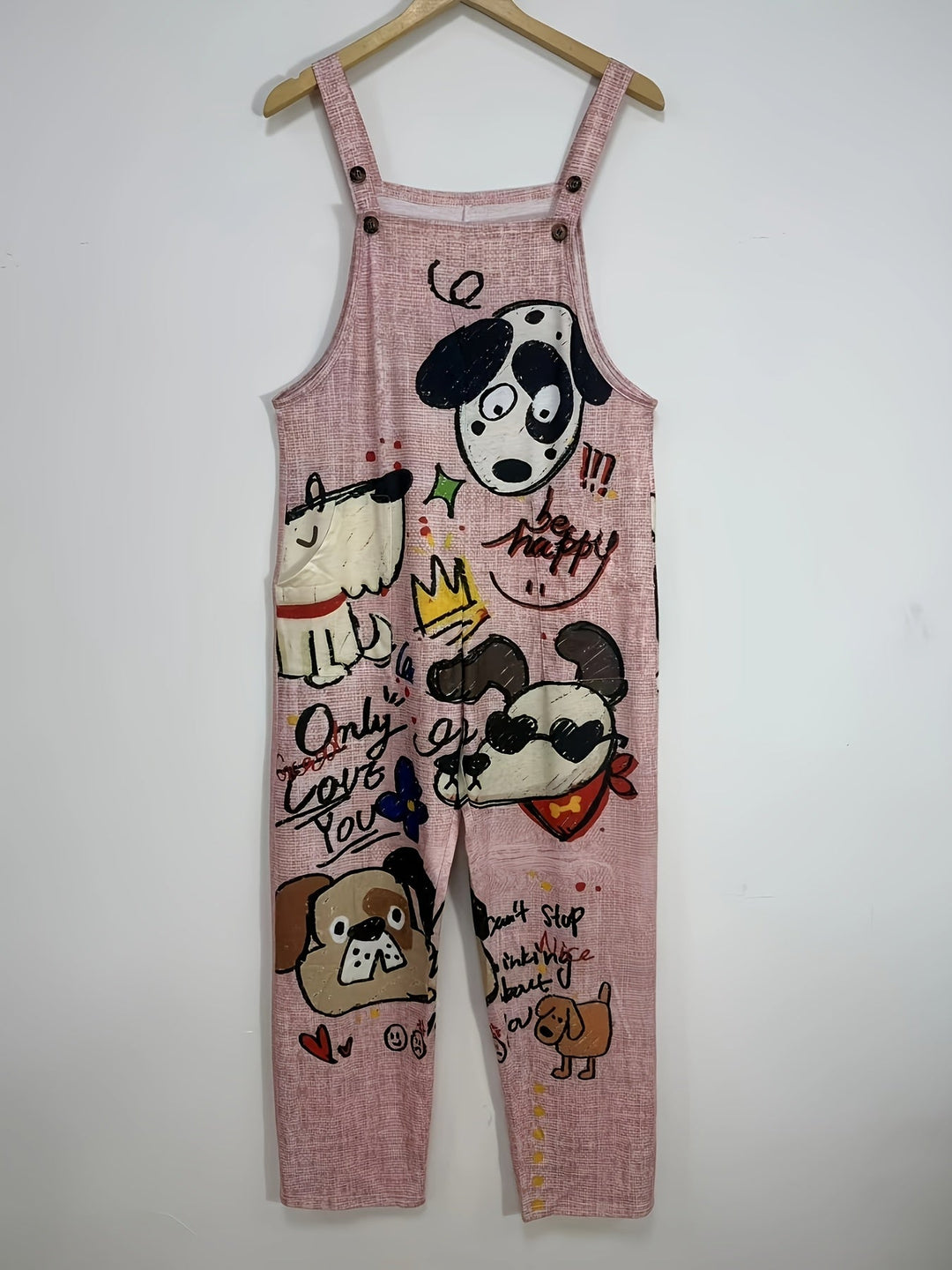 Adjustable strap & pocket detail on women's playful dog print wide-leg jumpsuit. Casual fashion.
