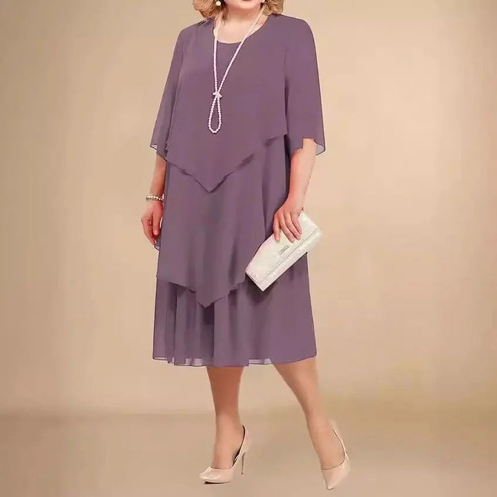 Elegant plus size asymmetrical midi dress for women, flattering fit for special occasions.