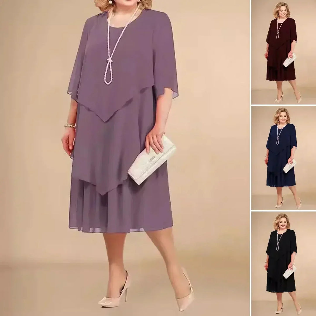 Stylish plus size asymmetrical midi dress for women, featuring a flattering layered design.