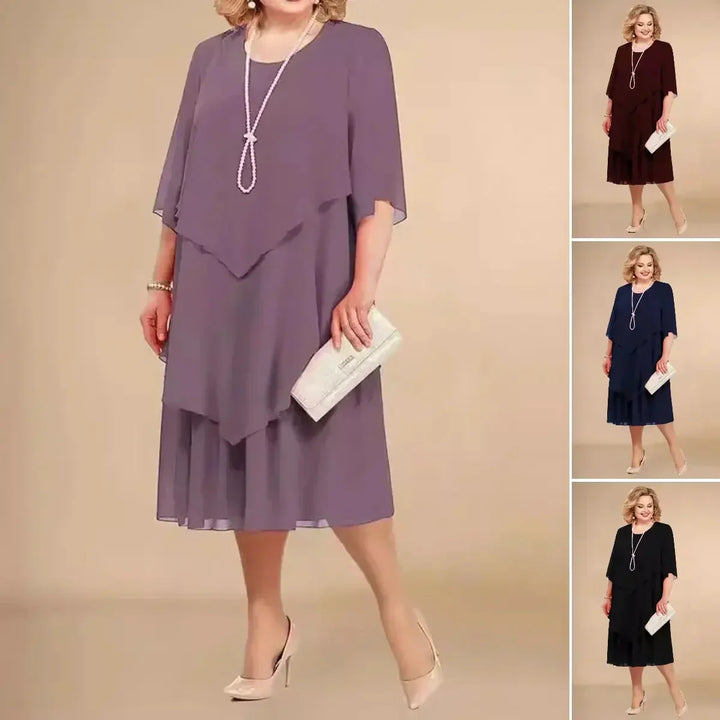 Stylish plus size asymmetrical midi dress for women, featuring a flattering layered design.